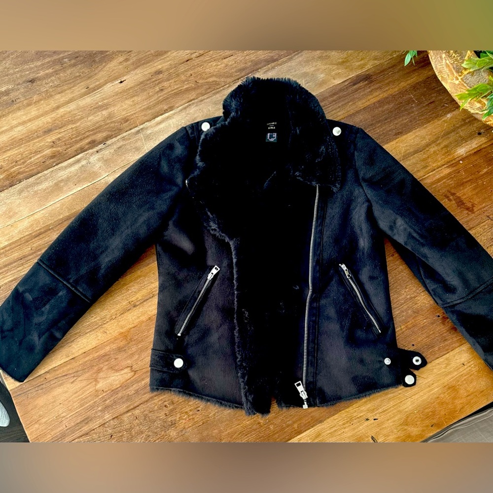 Suede jacket with fur trim.